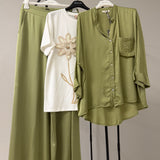 T-shirt bianca in cottone con fiore applicato