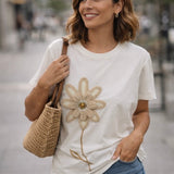 T-shirt bianca in cottone con fiore applicato